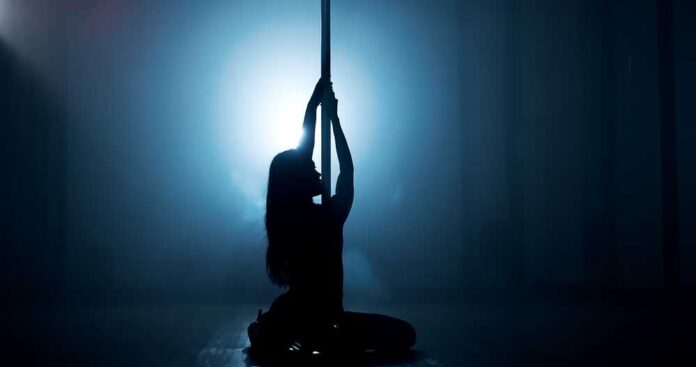 Woman,,Dancing,Or,Pole,With,Spotlight,For,Silhouette,,Tease,Performance