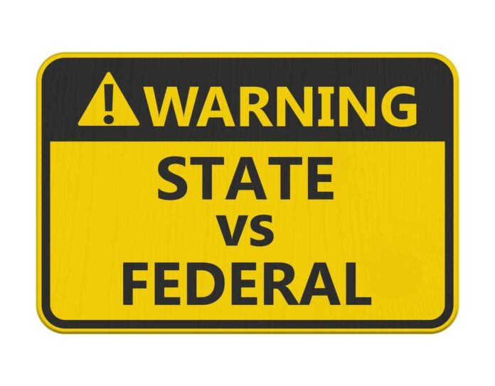 State,Vs,Federal,Warning,Sign,Isolated,On,White,For,Tension