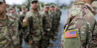 Military personnel standing in formation outdoors