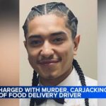 Woman charged after UberEats driver carjacked, fatally hit