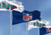 The Hijacking of the Super Bowl Four flags with NFL and Super Bowl LVII logos.