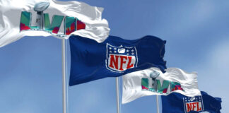 Four flags with NFL and Super Bowl LVII logos.