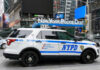 NYPD police SUV parked in urban street environment
