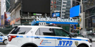 NYPD police SUV parked in urban street environment
