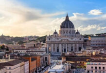 St Peters Basilica with surrounding cityscape at sunset