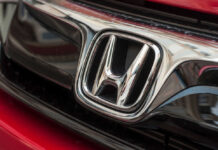 Close-up of a Honda car logo.