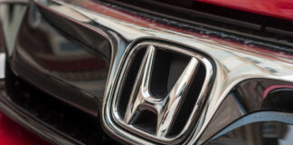 Close-up of a Honda car logo.
