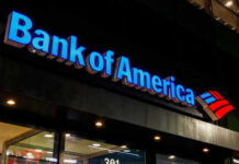 Bank of America sign on building exterior at night