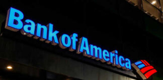 Bank of America sign on building exterior at night