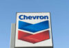 Chevron logo sign against blue sky