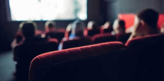 People watching a movie in a theater