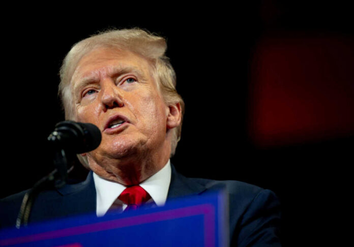 Man speaking at a podium with microphone