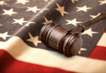 Judge Stops DOJ Power Play: Shocks Washington gavel on american flag