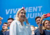 French Politics SHATTERED: Populists Gain Ground Group taking selfie with smiling woman at event