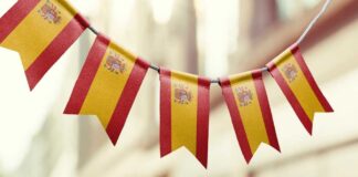 Bunting featuring the Spanish flag hanging in an outdoor setting