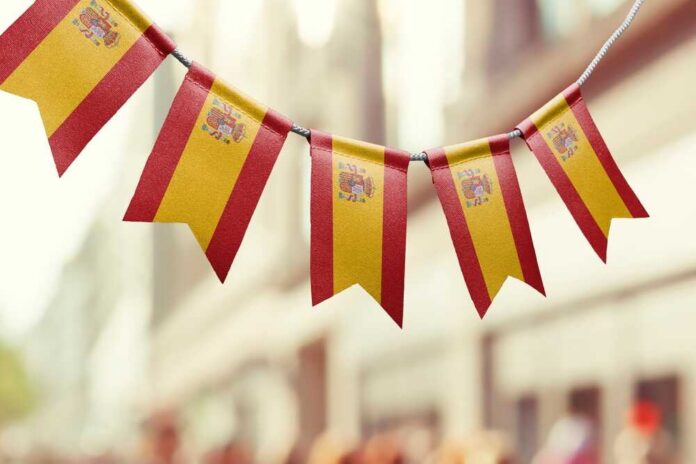 Bunting featuring the Spanish flag hanging in an outdoor setting