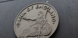 Emblem of the Bank of England featuring a seated figure with a spear and shield