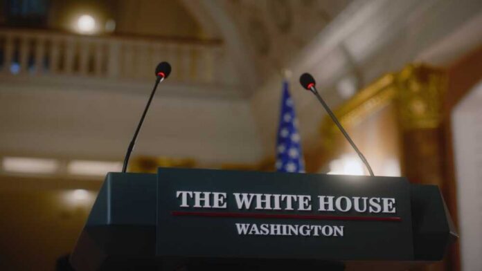 Podium with microphones at the White House for a press conference