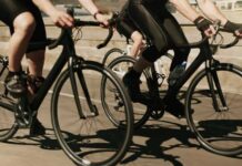 Illegal Bike Stunt Foiled: Police Swiftly Act Cyclists riding on a road in motion