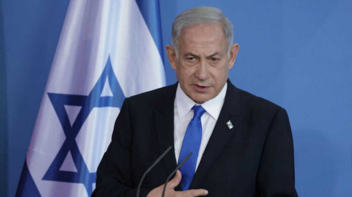 Israeli Prime Minister Benjamin Netanyahu_2458279225.jpg Man speaking in front of Israeli flag backdrop