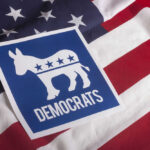 Democratic Party symbol on American flag background.