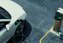 Ford CEO’s Warning: China’s Auto Invasion Looms Electric vehicle charging at a public charging station.