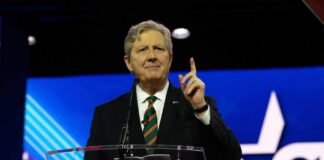 A politician delivering a speech at a CPAC conference