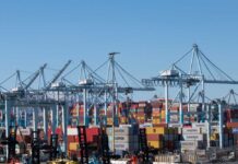 Cranes and shipping containers at a busy port
