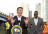 California’s Rail Debacle – Taxpayers’ Nightmare California governor speaking at a construction site with smiling attendees