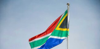 South African flag waving against a clear sky