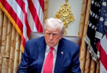 Shock Firings: Trump’s Loyalty Purge Donald Trump seated in the Oval Office with a serious expression