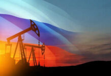 UK’s Quiet Sanctions Shift: Russian Fuel Re-Entry? Oil pumps silhouetted against Russian flag and sunset.