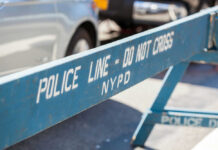 NYPD Powerless: Antisemitism Guidelines Scrapped Blue NYPD barricade with Police Line - Do Not Cross.