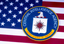CIA emblem on top of American flag.