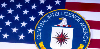 CIA emblem on top of American flag.