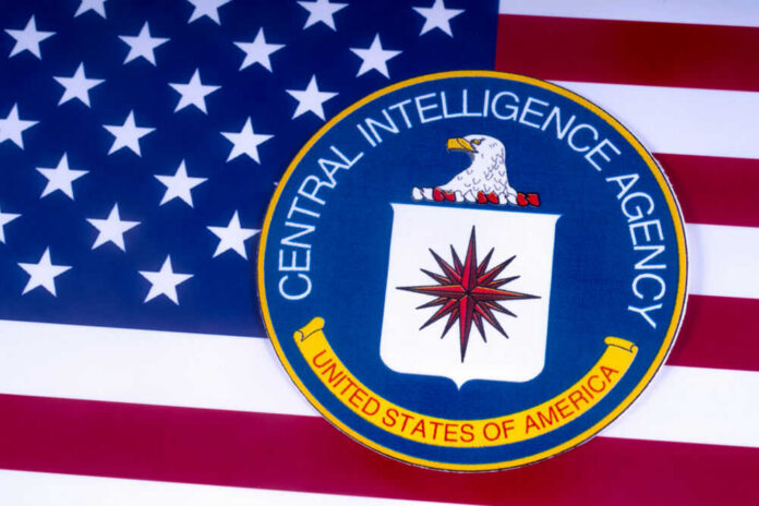 CIA emblem on top of American flag.