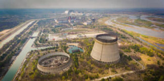 Nuclear power plant cooling towers and surrounding landscape