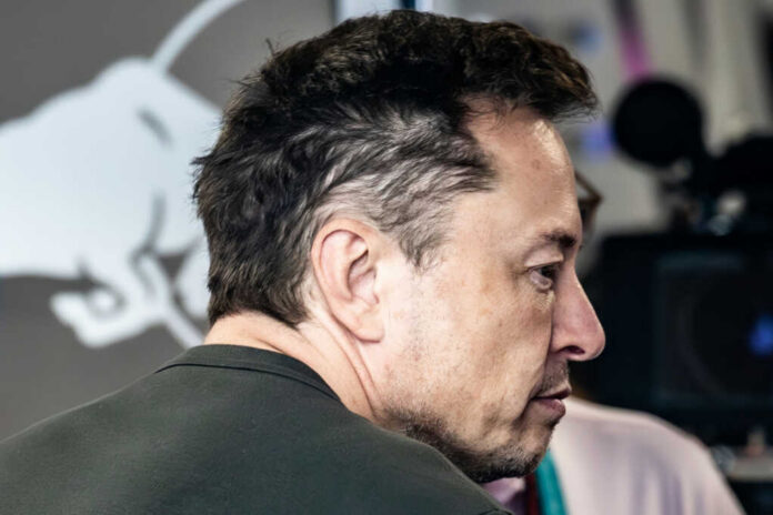 man in profile with short dark hair