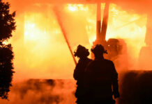 Firefighters battling intense blaze at night scene