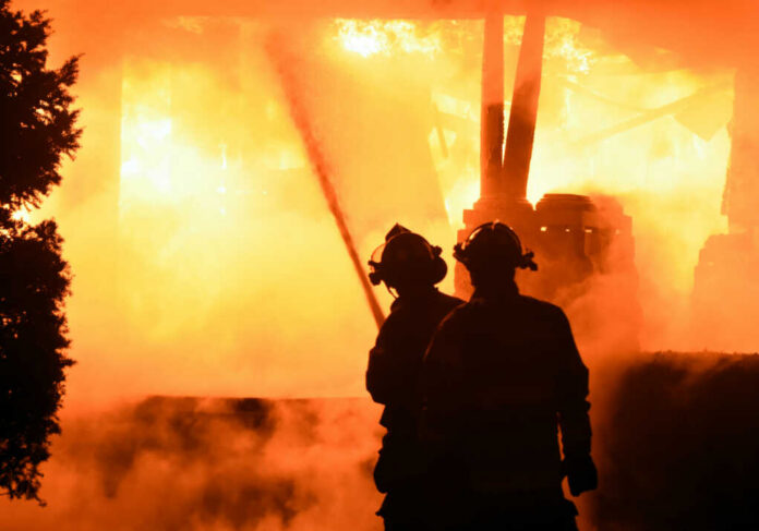 Firefighters battling intense blaze at night scene