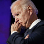 Prosecutors Stunned: Audio Catches Biden Forgetting He Was VP elderly man in suit resting chin on hand in thought