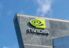 China’s Sneaky Chip Plot – Outmaneuvering U.S. Controls? Nvidia logo on building against blue sky