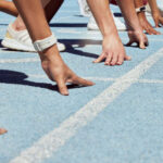 CA Gov Hopeful Steyer Backs Trans Athletes in Girls’ Sports Athletes at starting line on blue track race