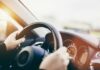 Driver Terrorizes Modena: Pedestrians Targeted Hands gripping a steering wheel inside a car