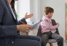 Shock Audit: Autism Therapy Spending Skyrockets 47,000% A child sitting on a chair while a professional gestures with a notepad and pencil