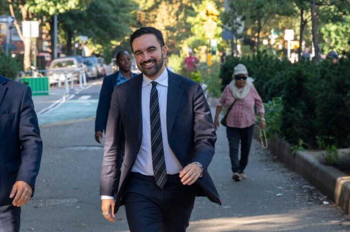 A man in a suit walking happily in a city park
