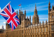 UK’s Gulf Agreement: Bold Move or Sneaky Play? British flag waving in front of the Parliament building in London