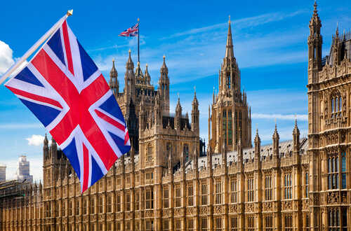 House,Of,Parliament,And,British,Flag British flag waving in front of the Parliament building in London