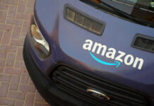 Amazon delivery van parked on brick pavement