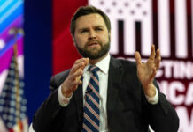 Iran Pulls Plug — Switzerland Talks Stall Man in suit speaking on stage with gesturing hands